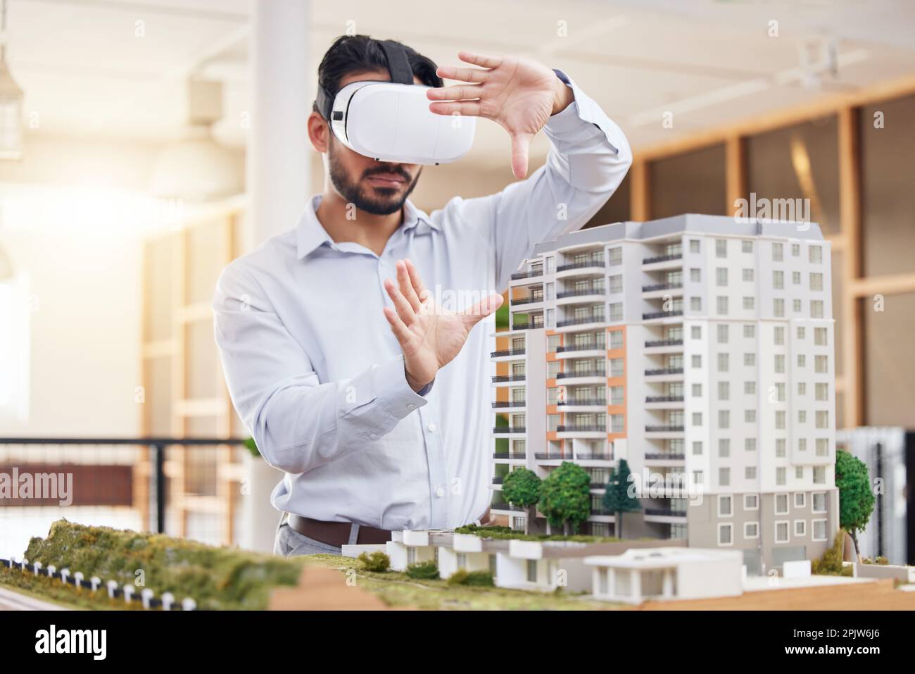 Architect, man and virtual reality architecture model, construction and building with future technology and UX. VR goggles, design and engineering Stock Photo
