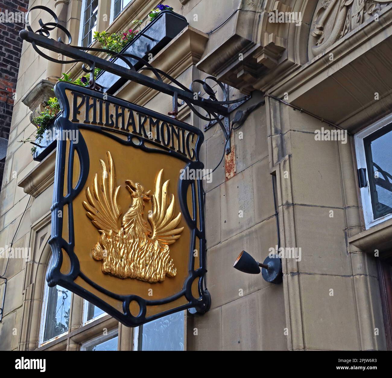 Golden pub sign at entrance to the Philharmonic Dining Rooms, 36 Hope St, Liverpool, Merseyside, England, UK, L1 9BX Stock Photo