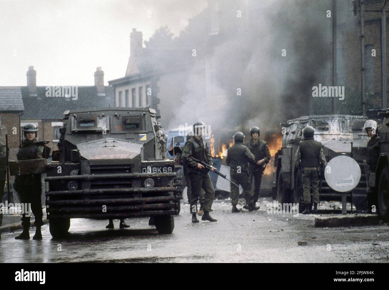 FILE - British troops with their armored personnel carriers surround a ...