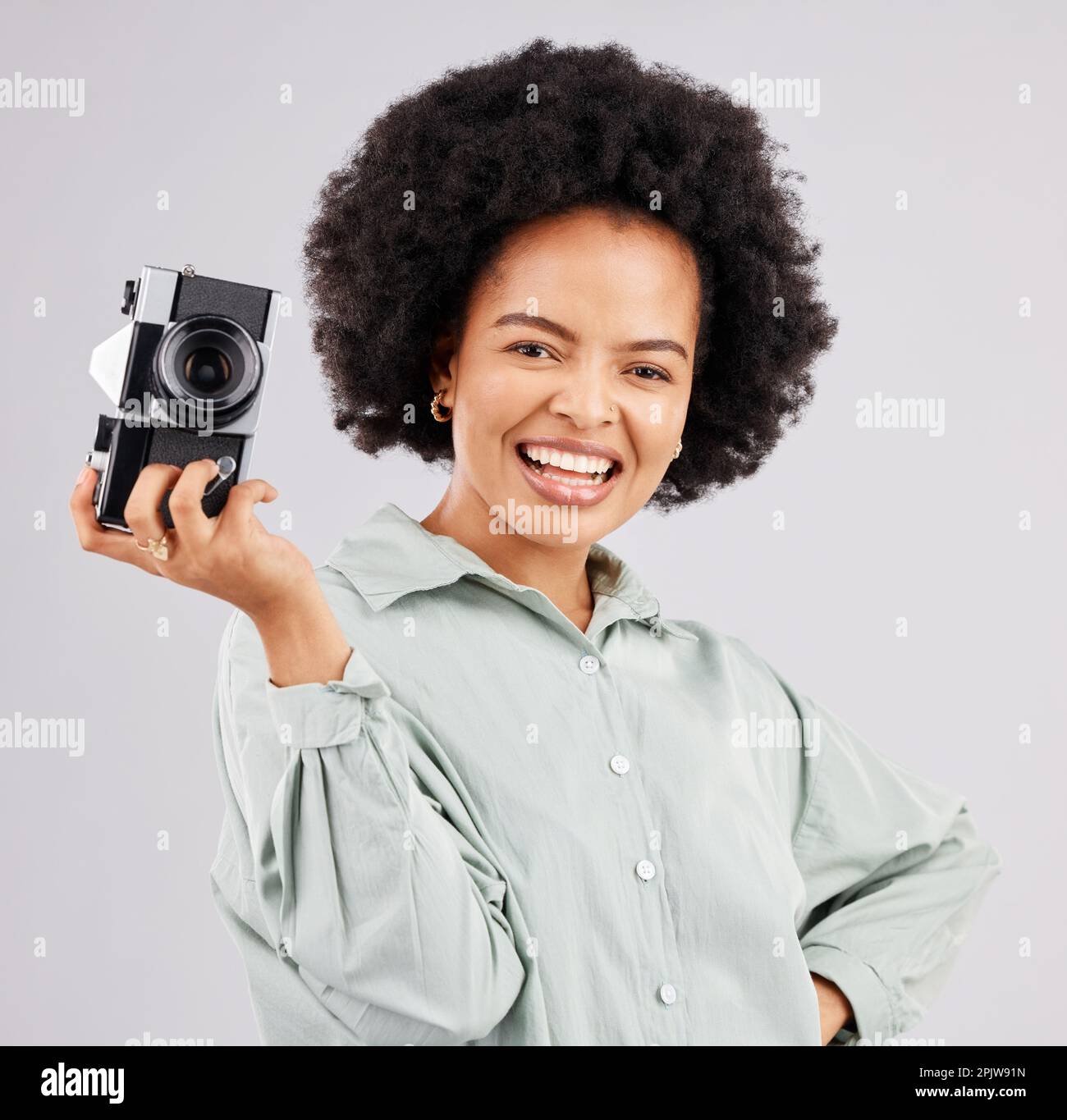 Portrait, camera photographer and black woman smile in studio isolated