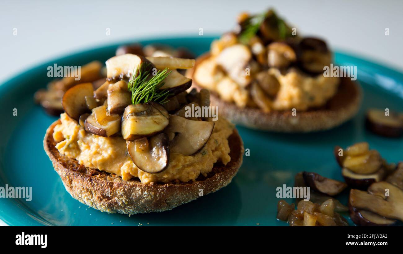 Toast with hummus and sautéed mushrooms. vegan recipe Stock Photo Alamy