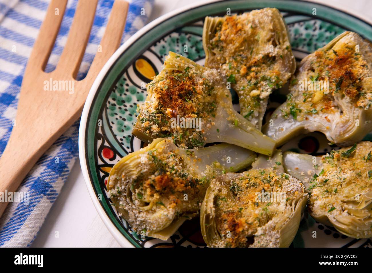 Baked artichokes with salt. Traditional Spanish recipe Stock Photo Alamy