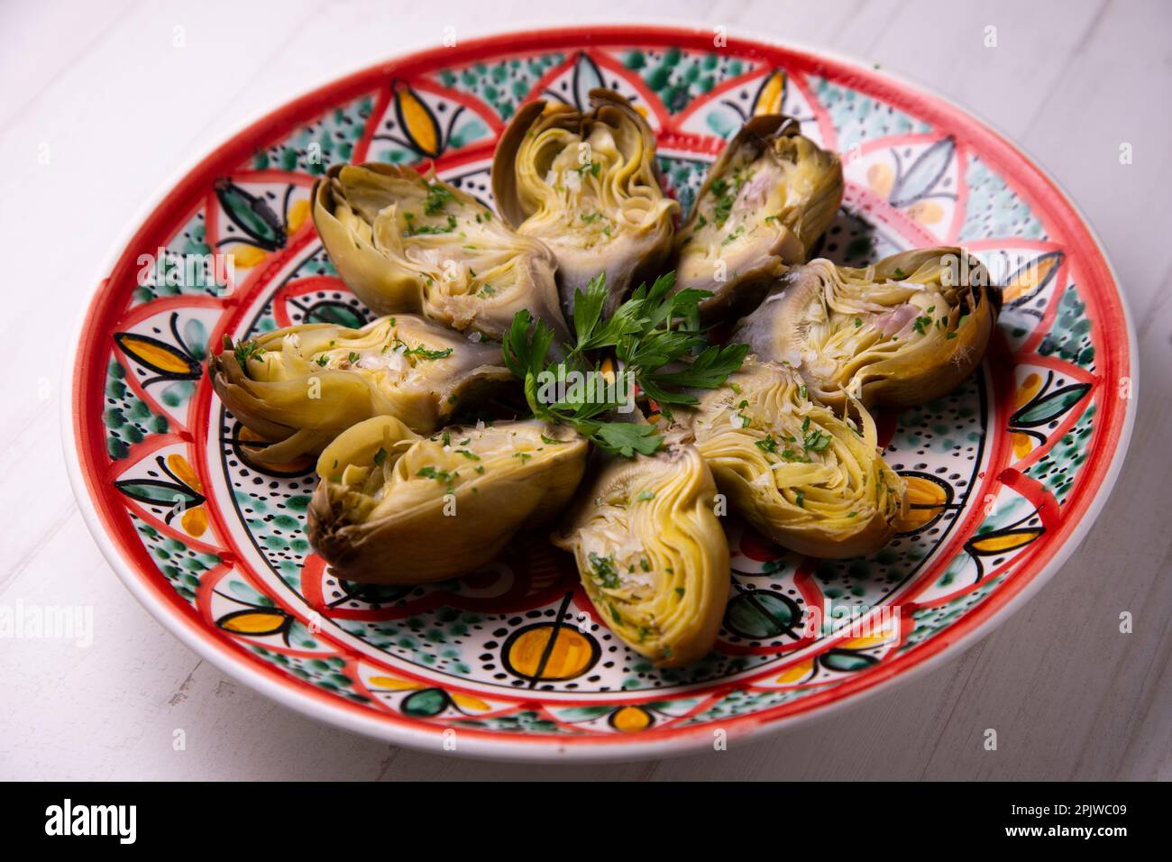 Baked artichokes with salt. Traditional Spanish recipe Stock Photo Alamy