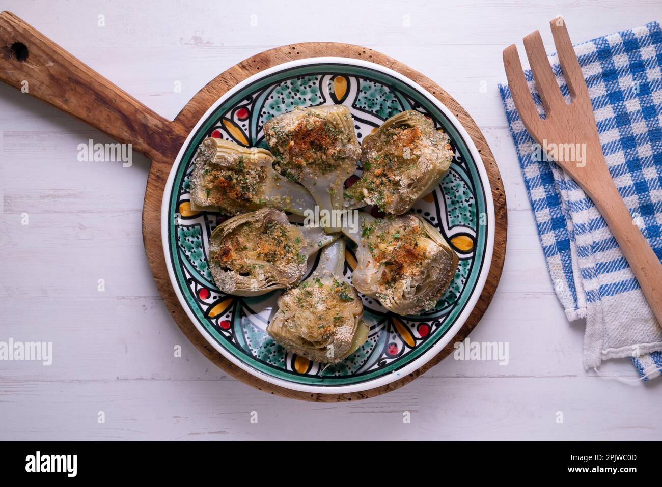 Baked artichokes with salt. Traditional Spanish recipe Stock Photo Alamy