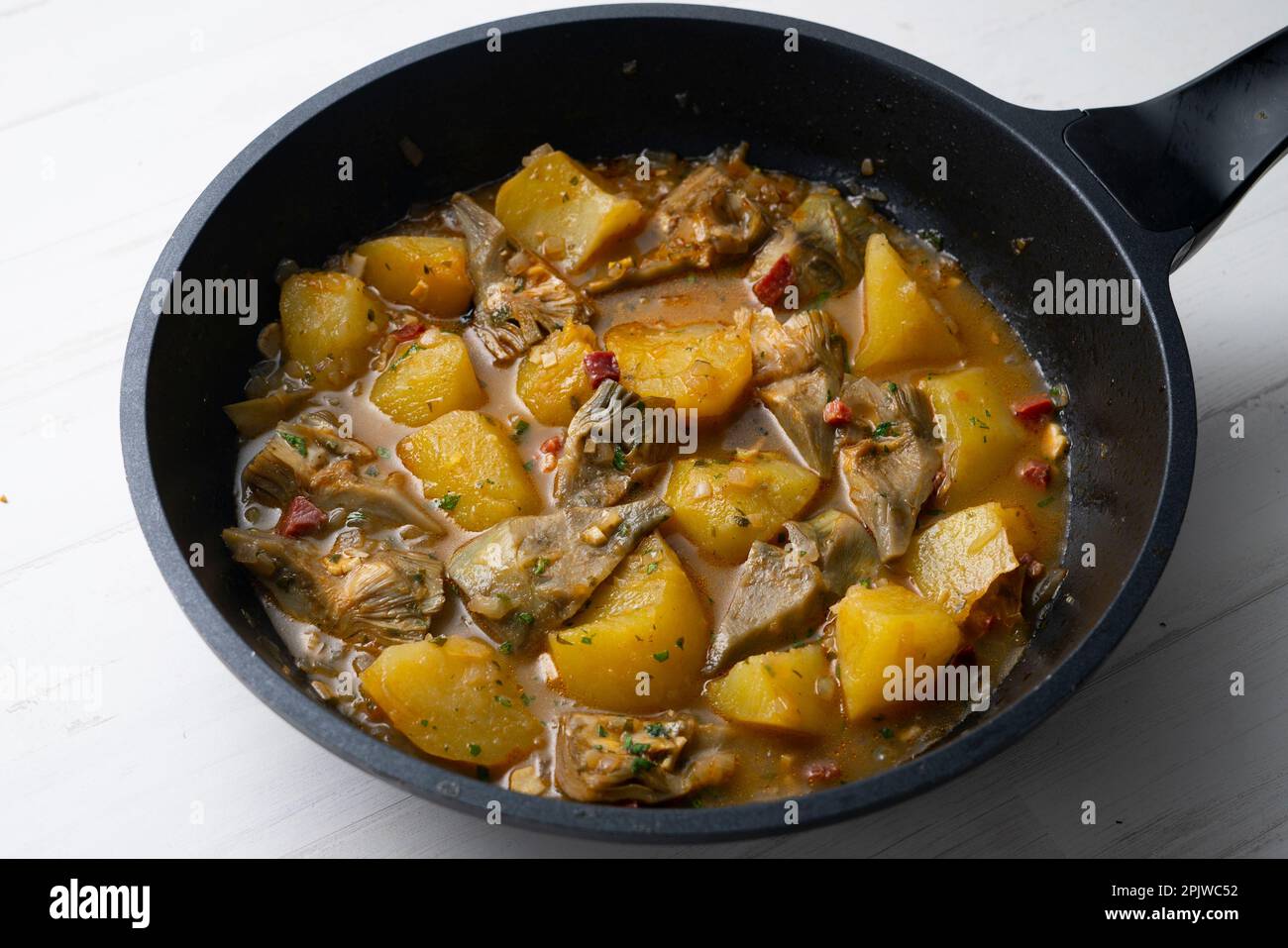 Tapa of artichokes with ham in a Spanish restaurant Stock Photo Alamy