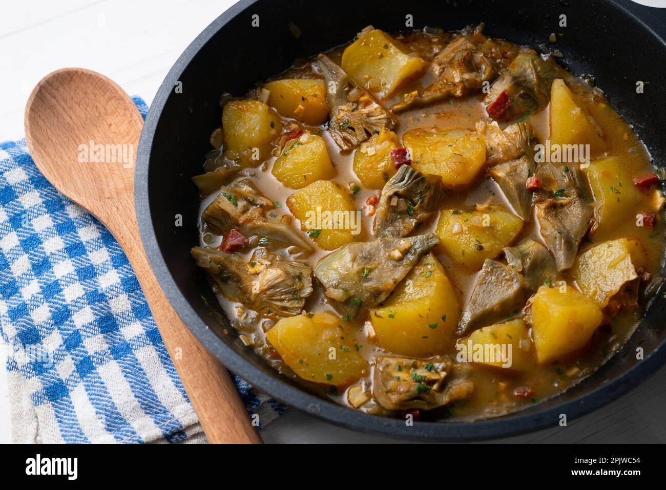 Tapa of artichokes with ham in a Spanish restaurant Stock Photo Alamy