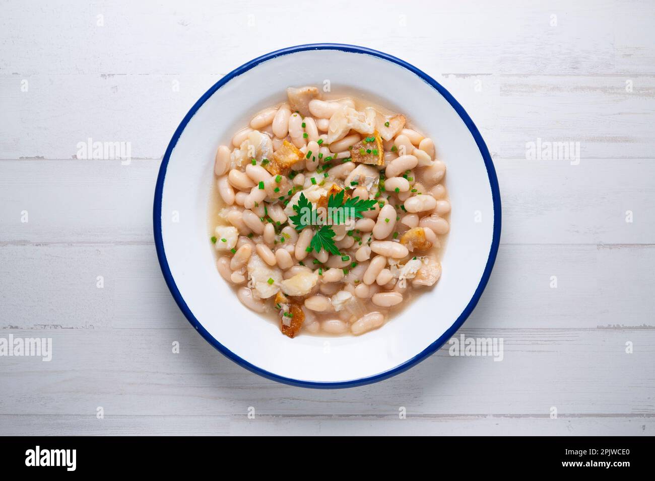 White bean stew with bacon. Traditional Spanish recipe Stock Photo Alamy