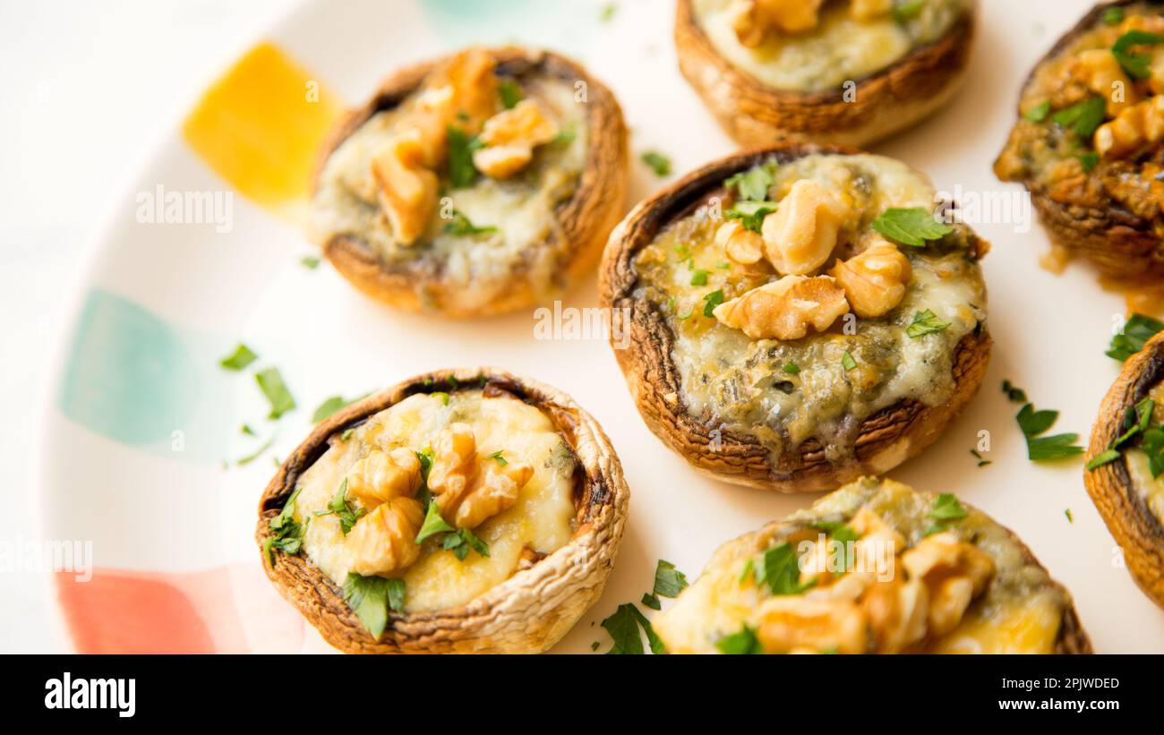 Baked mushrooms stuffed with walnuts and cheese. Traditional Spanish