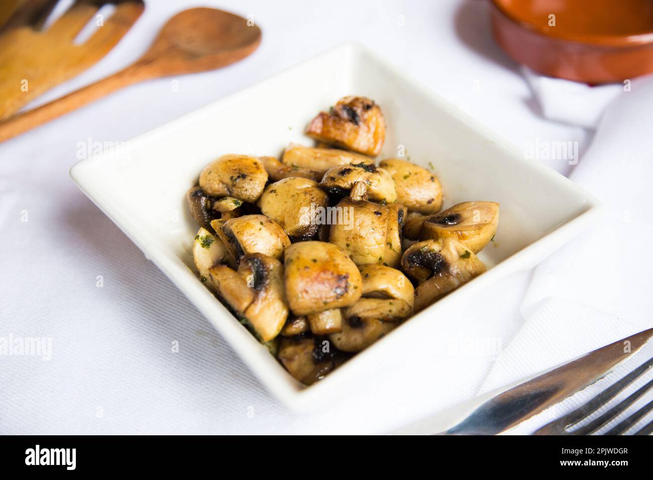 Mushrooms cooked with white wine. Traditional Spanish tapa Stock Photo