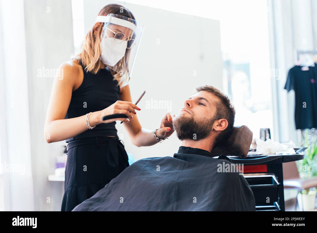 Professional stylist protective mask hi-res stock photography and ...