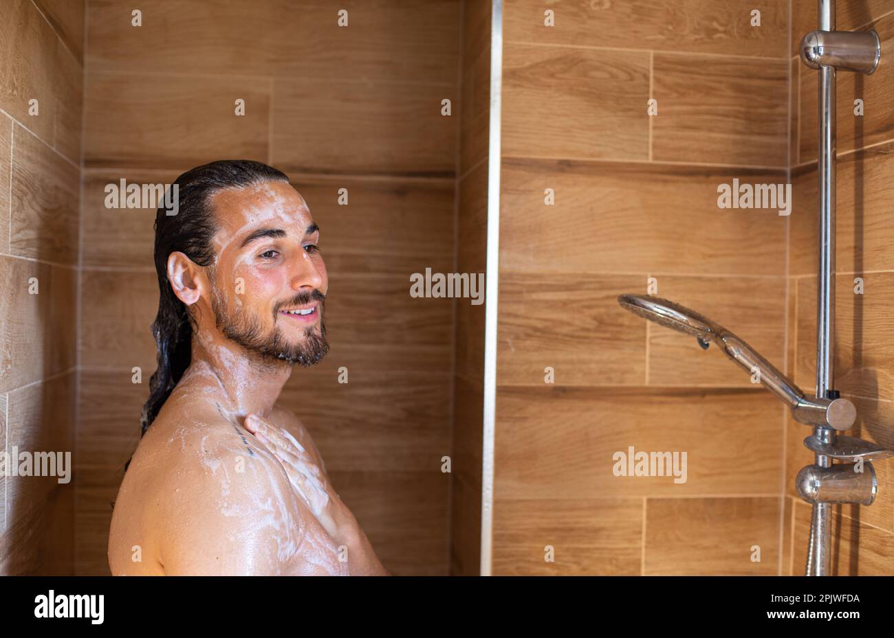 Long hair man showering hi-res stock photography and images - Alamy