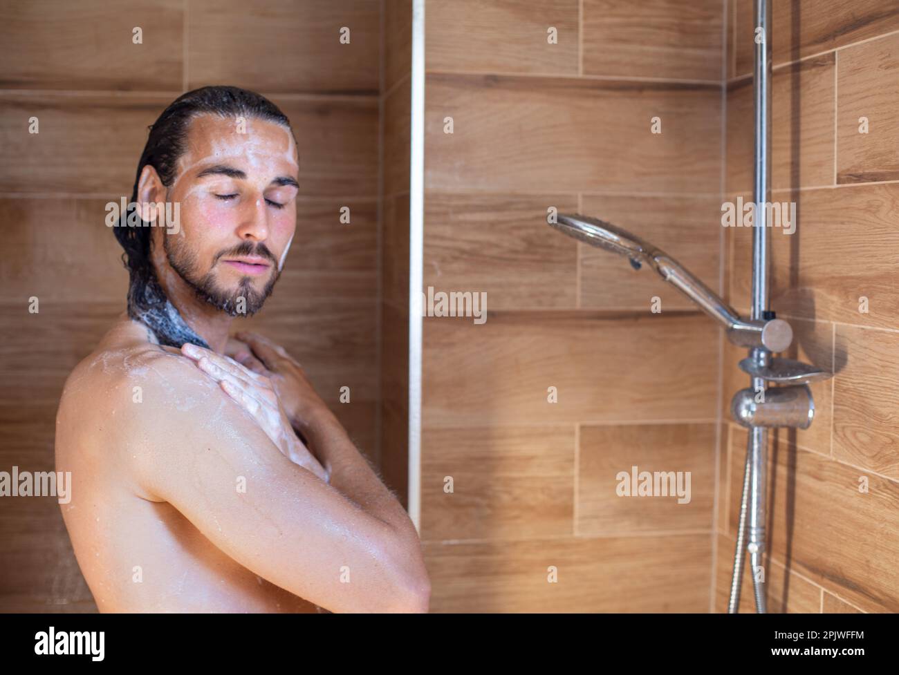 Long hair man showering hi-res stock photography and images - Alamy