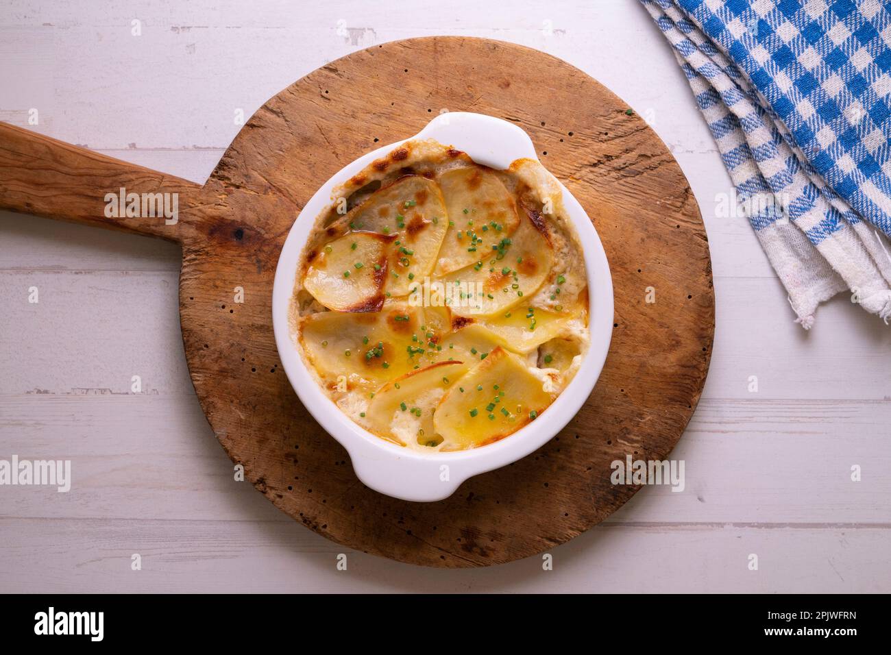 Baked potato slices gratin. Traditional Spanish recipe Stock Photo Alamy