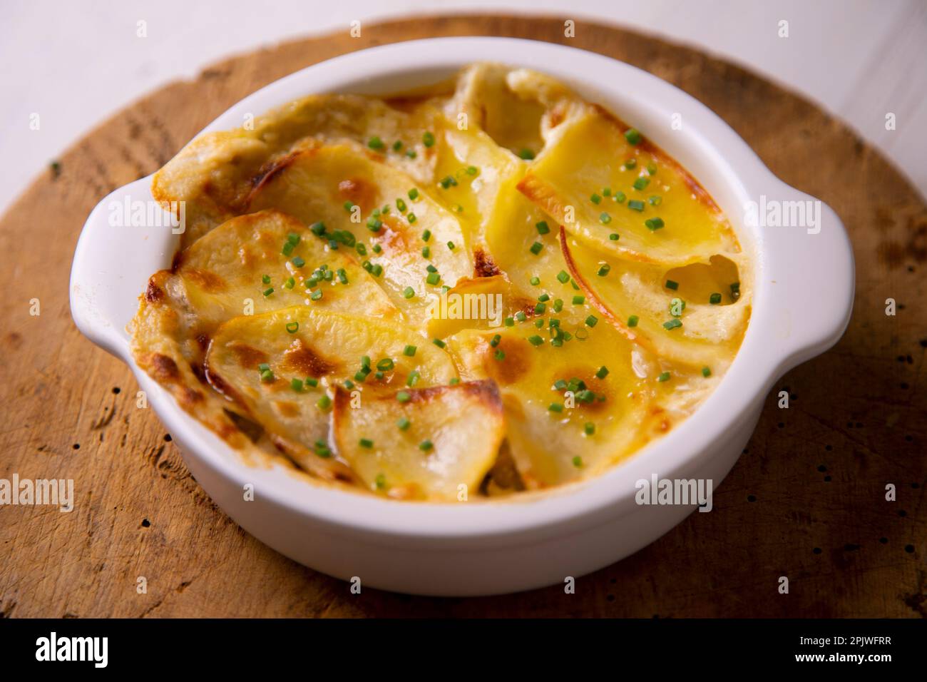 Baked potato slices gratin. Traditional Spanish recipe Stock Photo Alamy