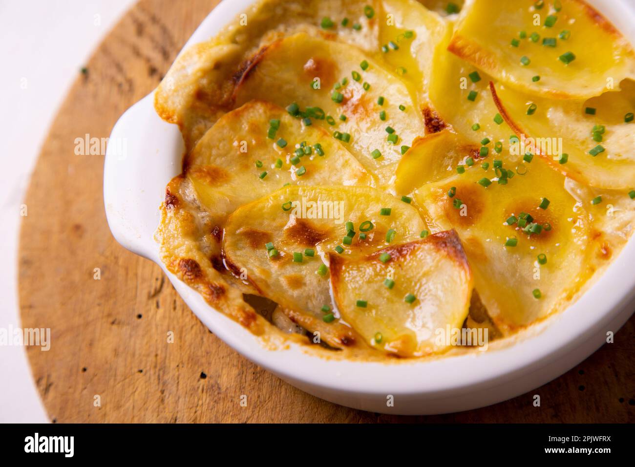 Baked potato slices gratin. Traditional Spanish recipe Stock Photo Alamy
