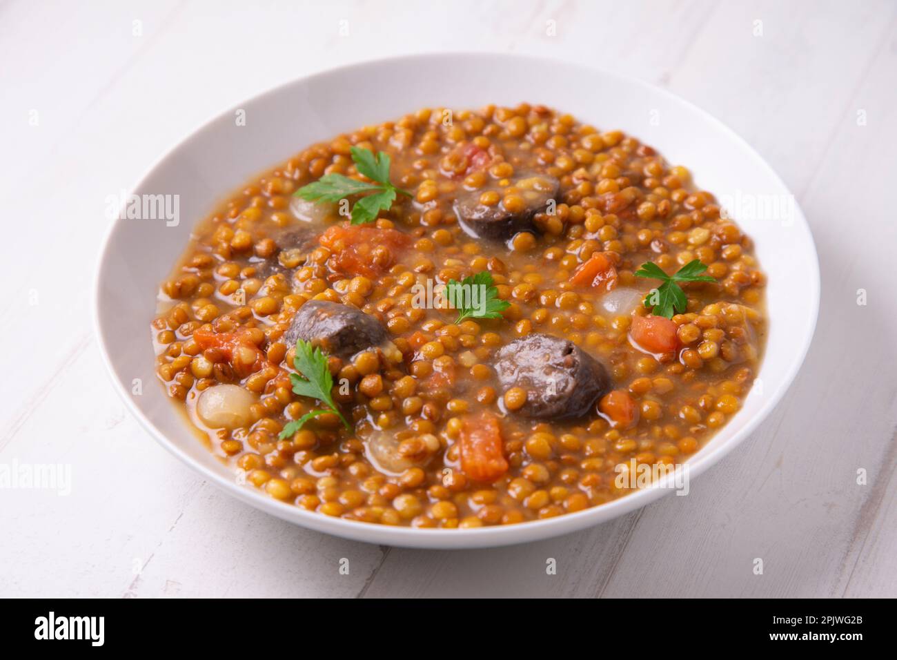 Lentil dish with potato, chorizo and black pudding. Traditional Spanish