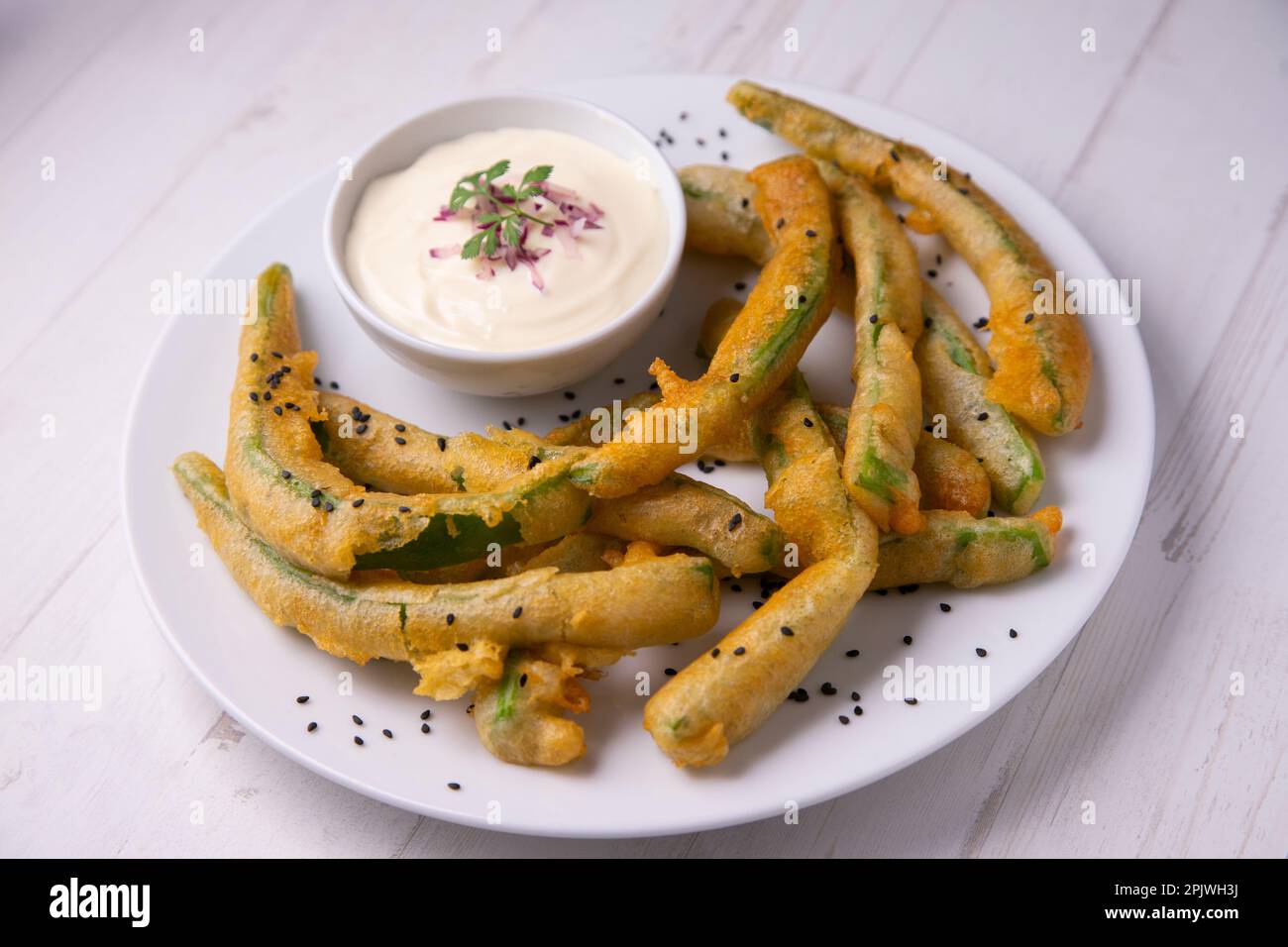 Plate of green beans in tempura with mayonnaise. Traditional Japanese