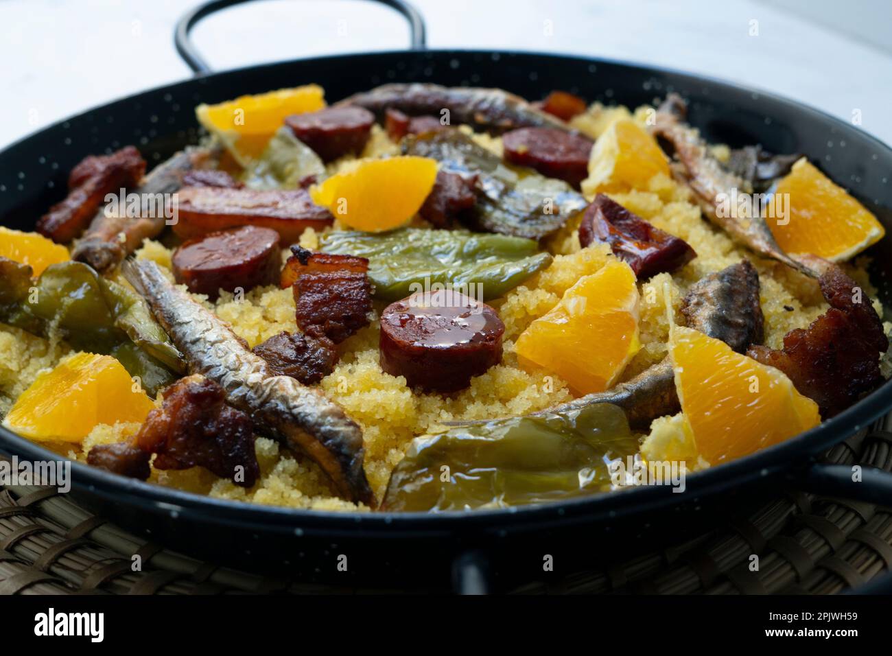 Spanish Migas tapa. Recipe with breadcrumbs, anchovies, chorizo and