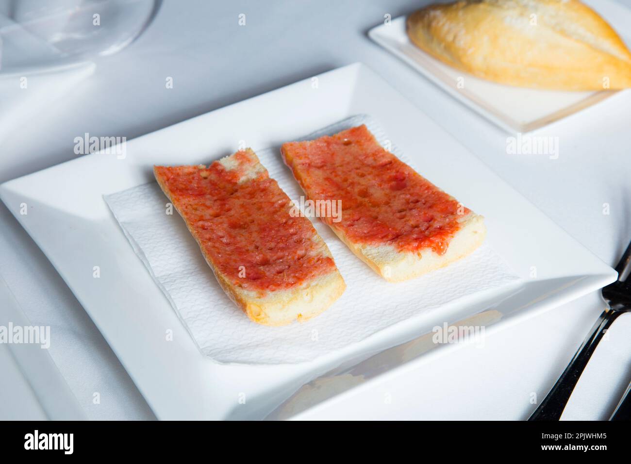 Toasted bread with tomato and oil. Traditional Spanish tapa Stock Photo ...