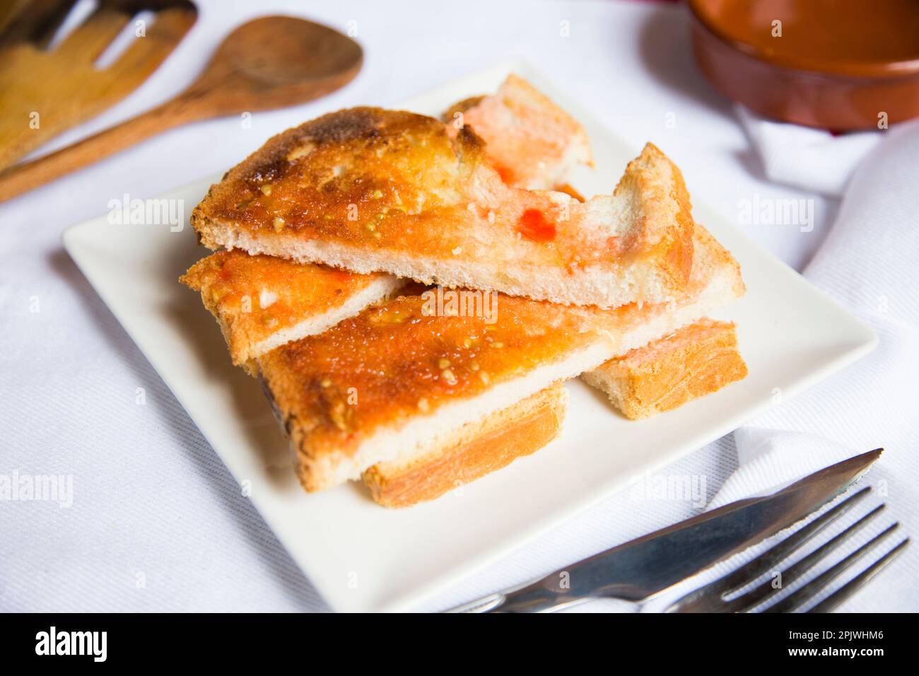Toasted bread with tomato and oil. Traditional Spanish tapa Stock Photo ...