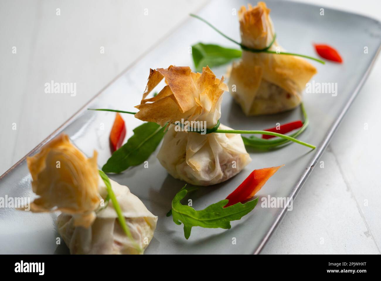 Ovenbaked filo pastry vegetable packets Stock Photo Alamy