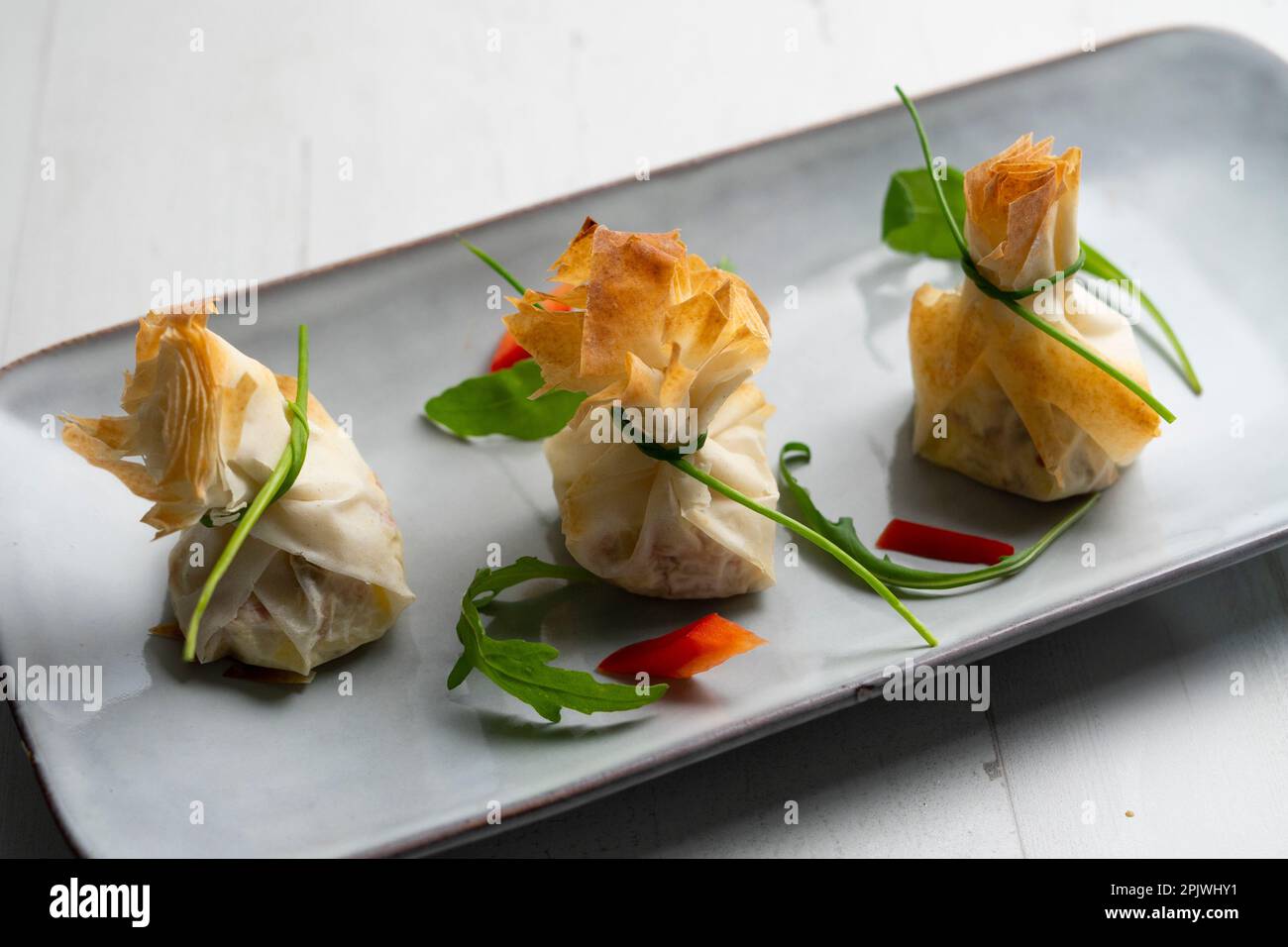 Ovenbaked filo pastry vegetable packets Stock Photo Alamy