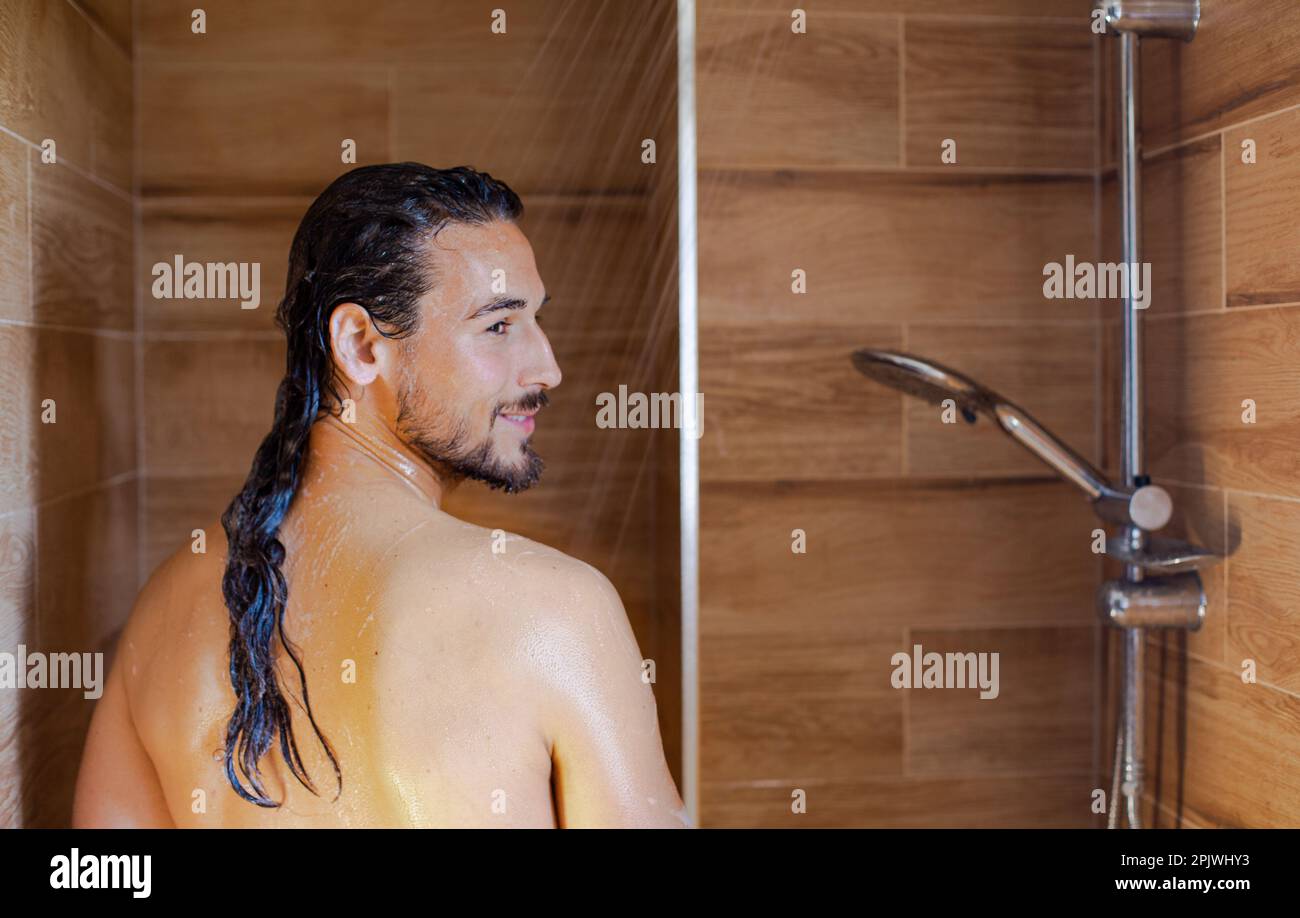 Long hair man showering hi-res stock photography and images - Alamy