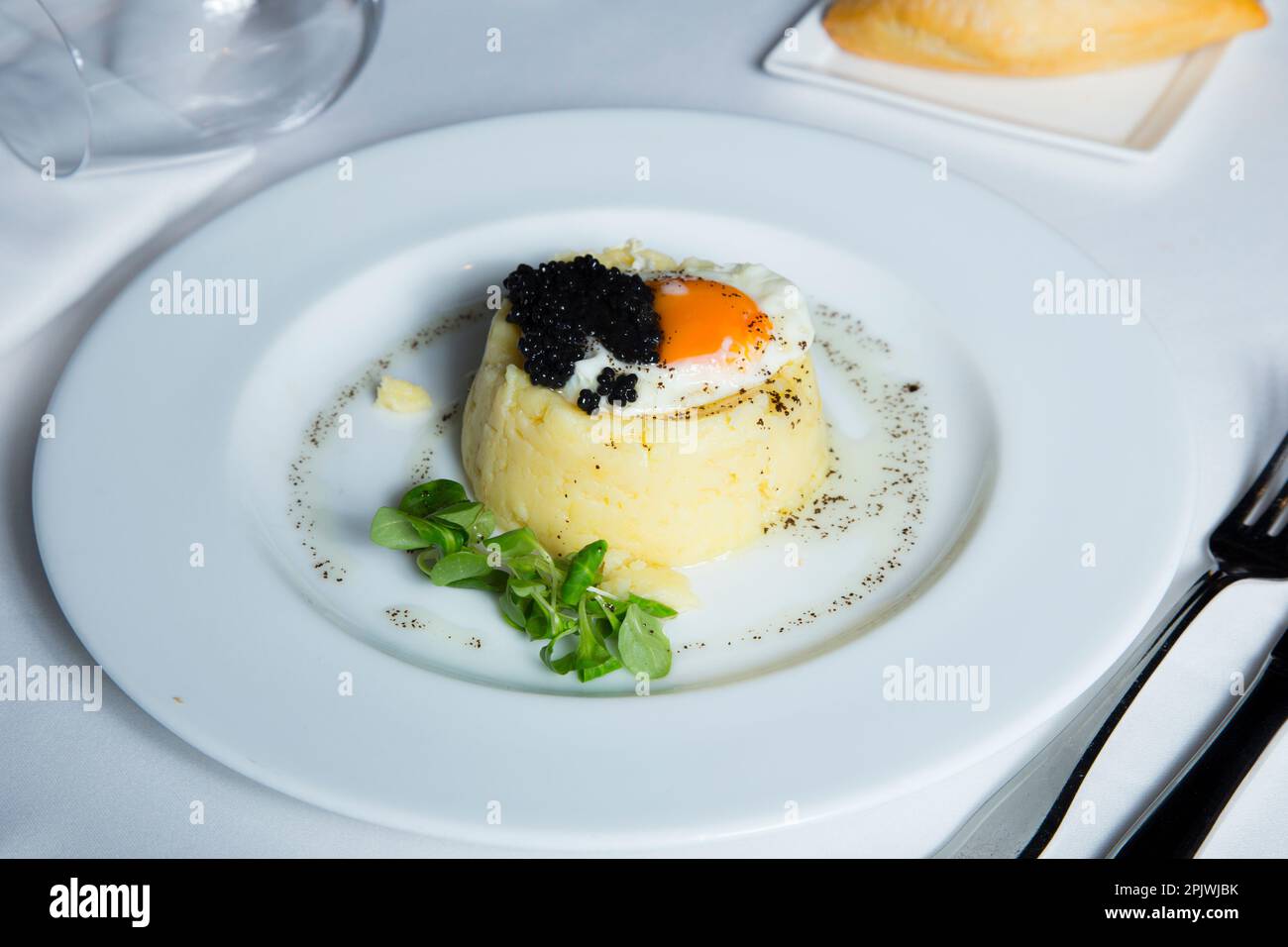 Boiled and mashed potato with an egg on top Stock Photo Alamy