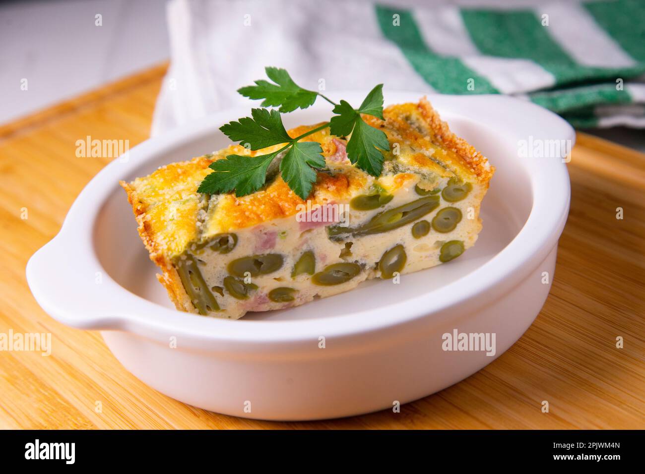 Egg pudding, green beans and baked ham Stock Photo Alamy