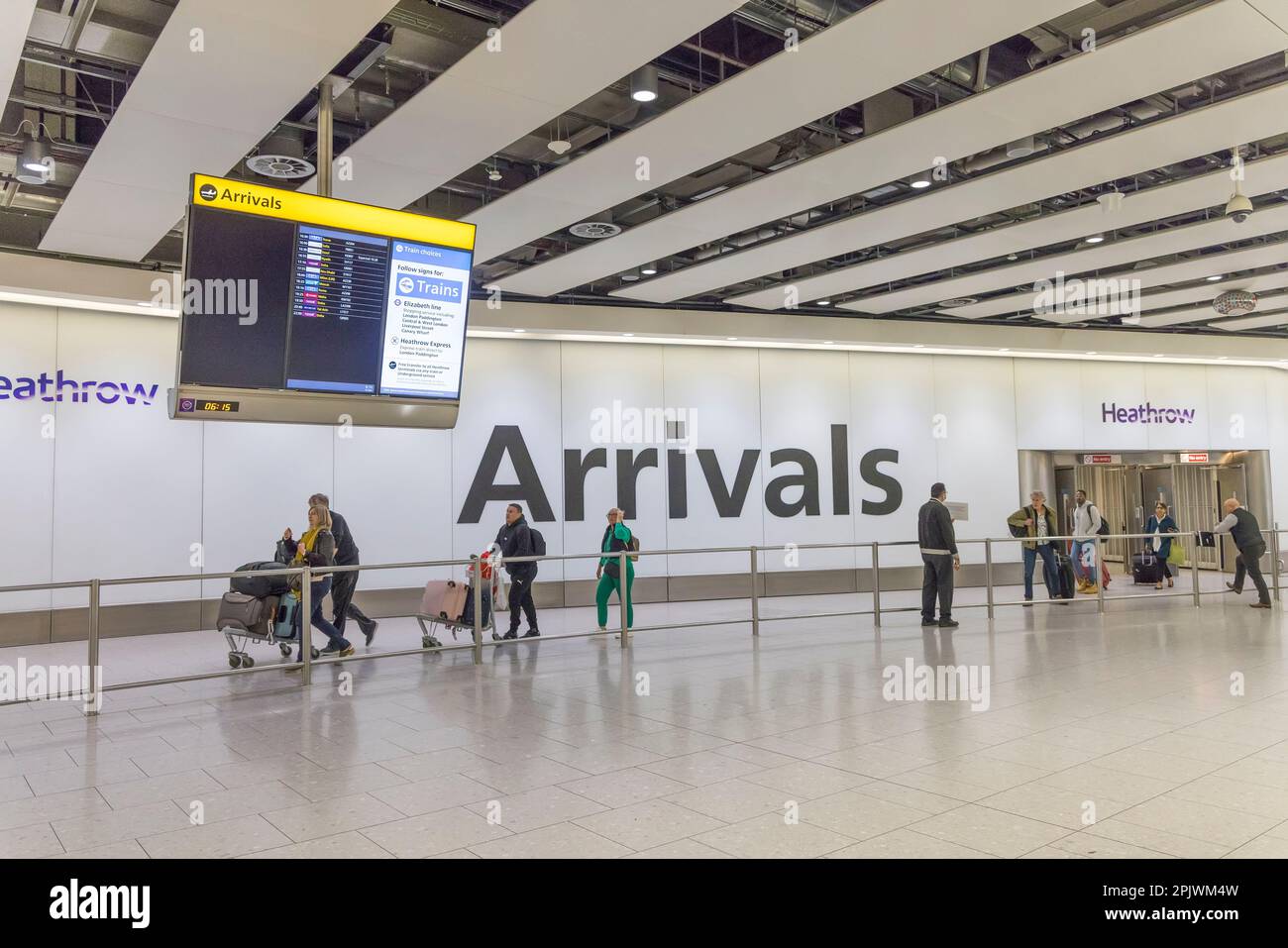 Passengers in arrivals hall, Heathrow airport, London, England, UK