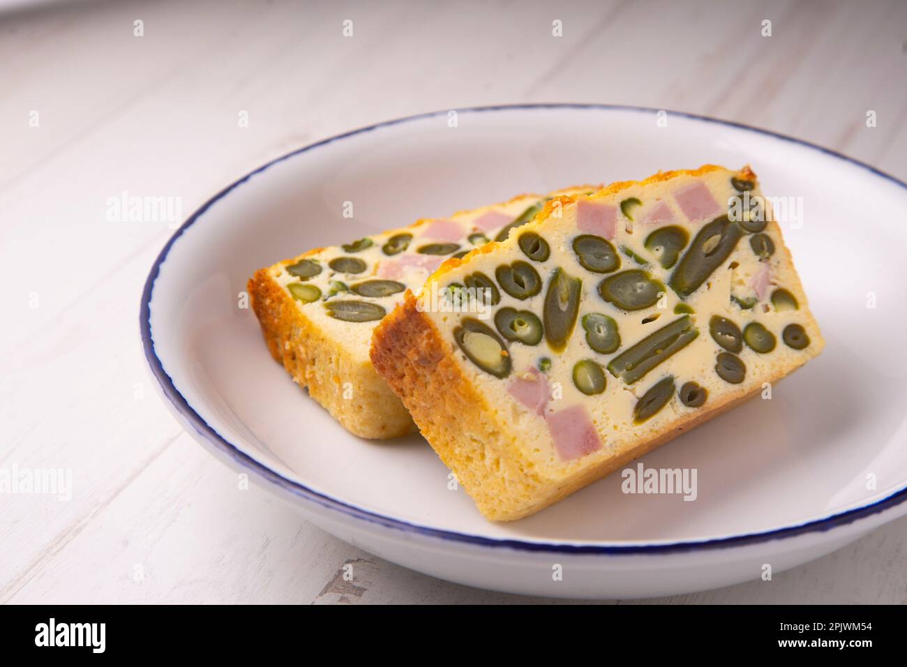 Egg pudding, green beans and baked ham Stock Photo Alamy