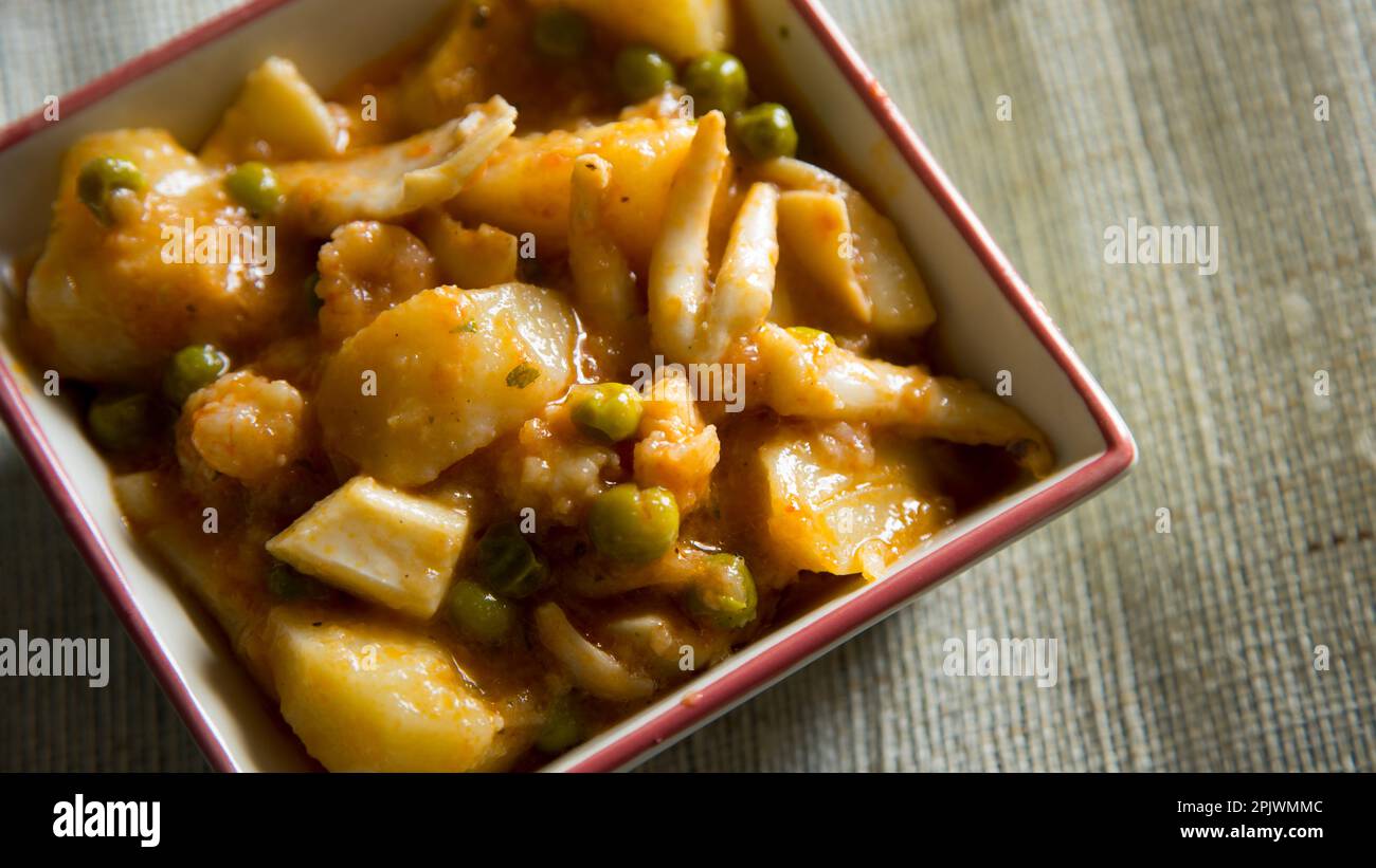 Stewed cuttlefish with potatoes. Traditional Spanish tapa recipe. Stock Photo
