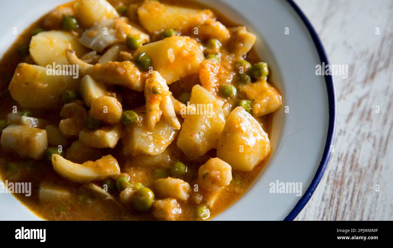 Stewed cuttlefish with potatoes. Traditional Spanish tapa recipe Stock