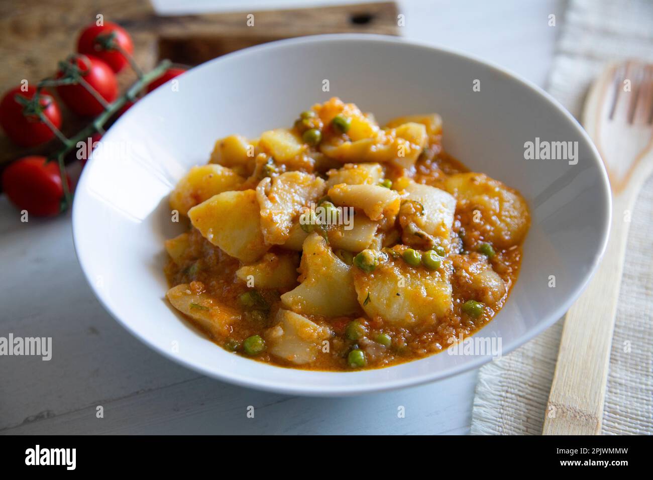 Stewed cuttlefish with potatoes. Traditional Spanish tapa recipe. Stock Photo