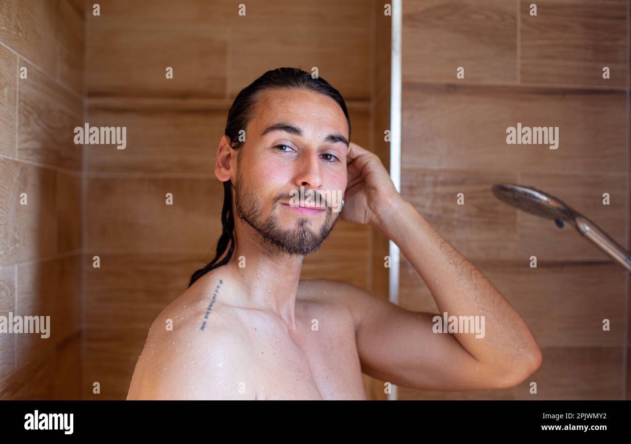Long hair man showering hi-res stock photography and images - Alamy