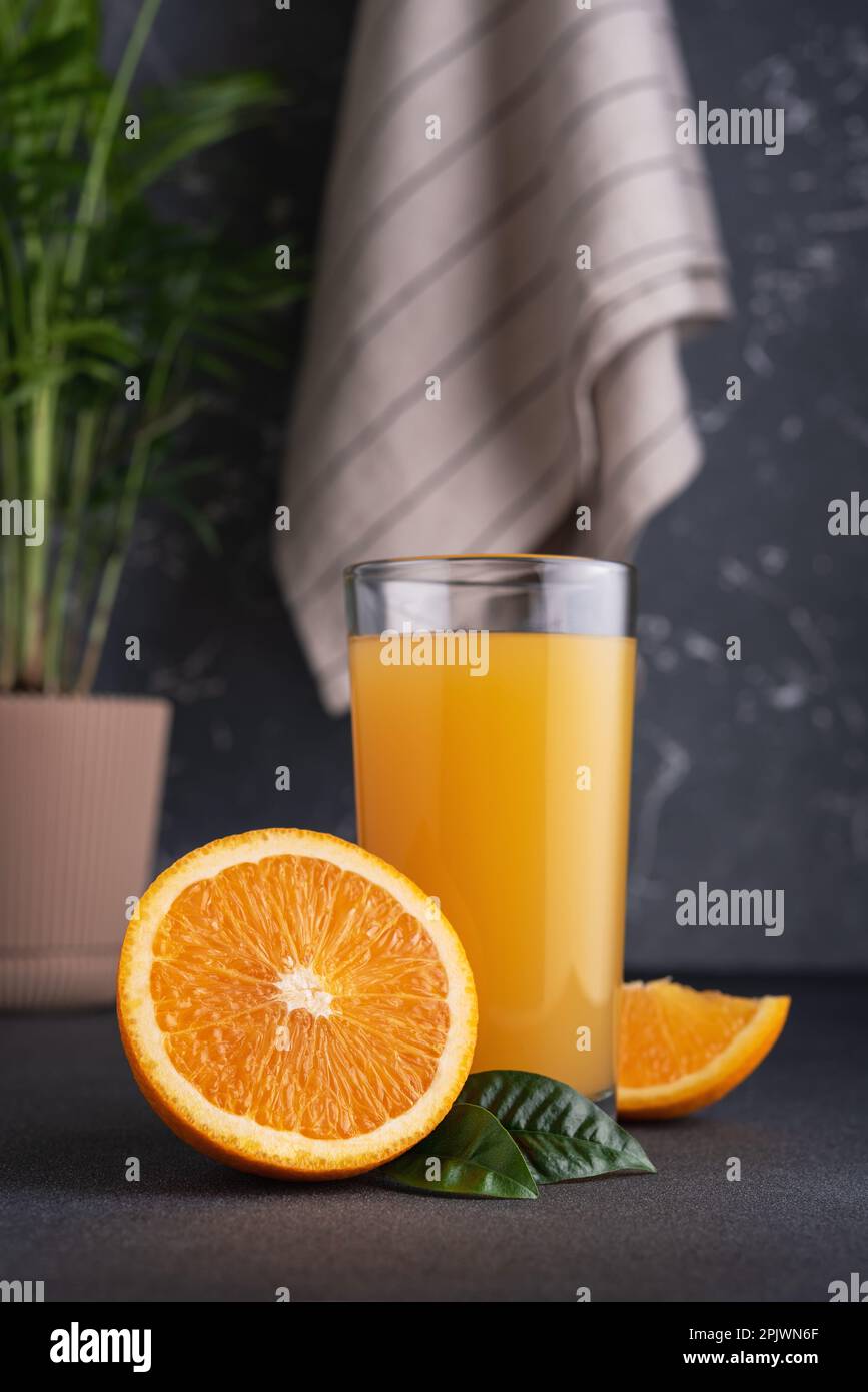 Glass jug of fresh orange juice with ripe orange fruits Stock Photo