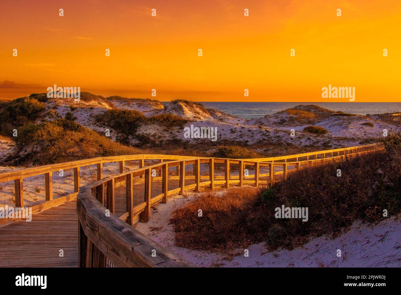 Sunset on a boardwalk leading to Rosemary Beach Stock Photo Alamy