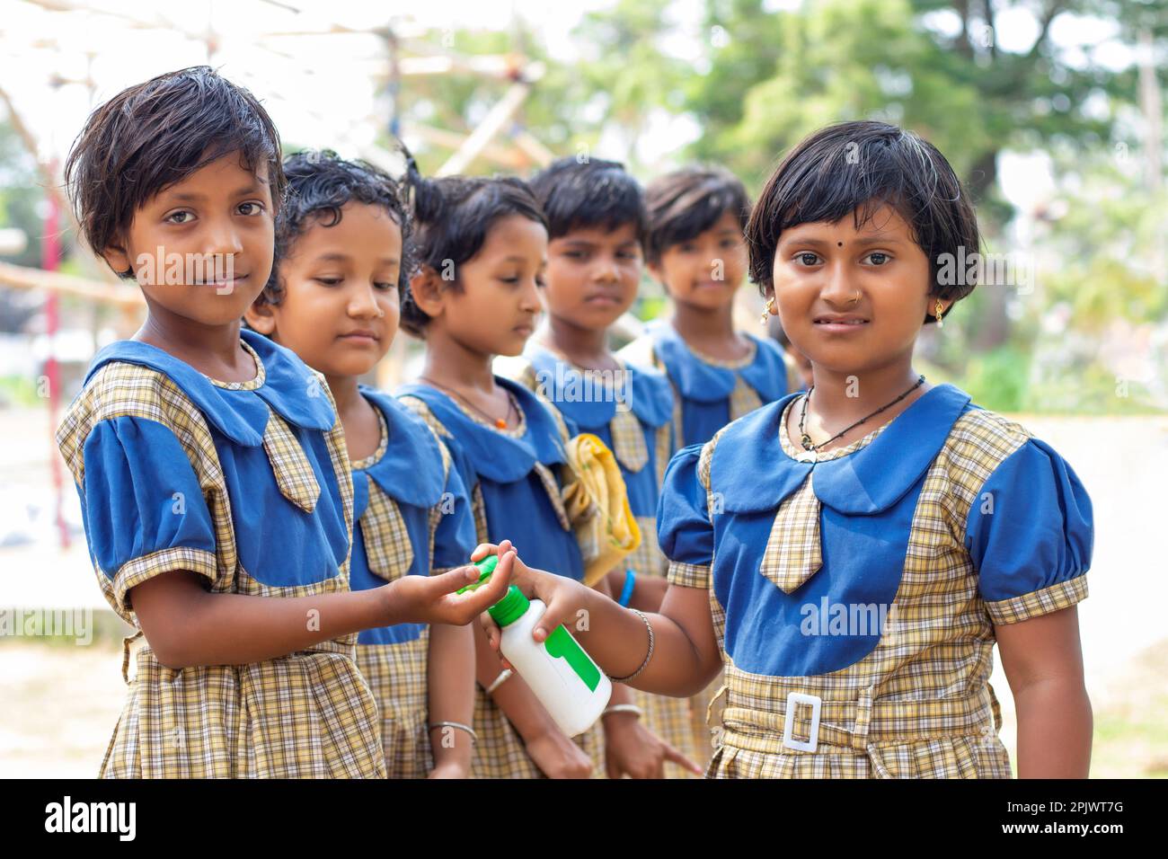 School students Eating after using hand wash at school Stock Photo