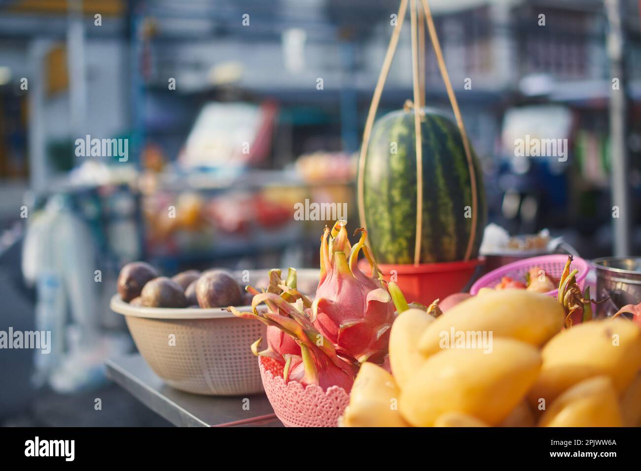 Stall with a diverse selection of tropical fruit at a street market in Bangkok. Stock Photo