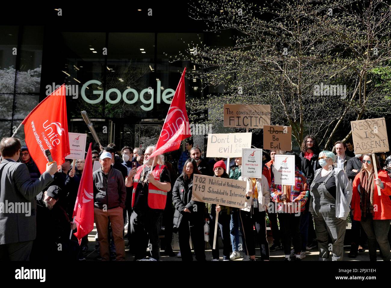 Google employees hold signs during a protest outside Google ...