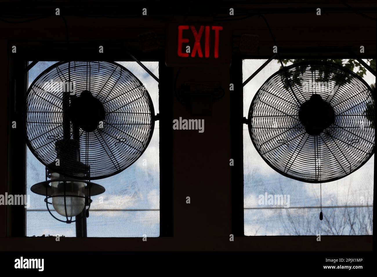 Dual fans are set to remove inside hot air in a screened in windows