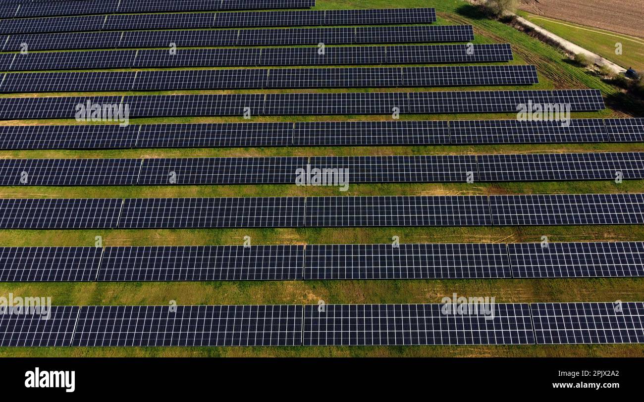 Aerial view of the largest Walloon solar panel installation, in Braine l'Alleud, Tuesday 04 April 2023. The municipality of Braine-l'Alleud inaugurated a field of photovoltaic panels of 19 hectares, designed by the municipal authorities and located in an old sand pit. Nearly 18,500 south-facing two-sided photovoltaic panels will provide up to 40 million kWh each year - i.e. the annual consumption of 4,000 households - and the electricity will arrive directly on the site of the UCB company, located at a few hundred meters. BELGA PHOTO ERIC LALMAND Credit: Belga News Agency/Alamy Live News Stock Photo