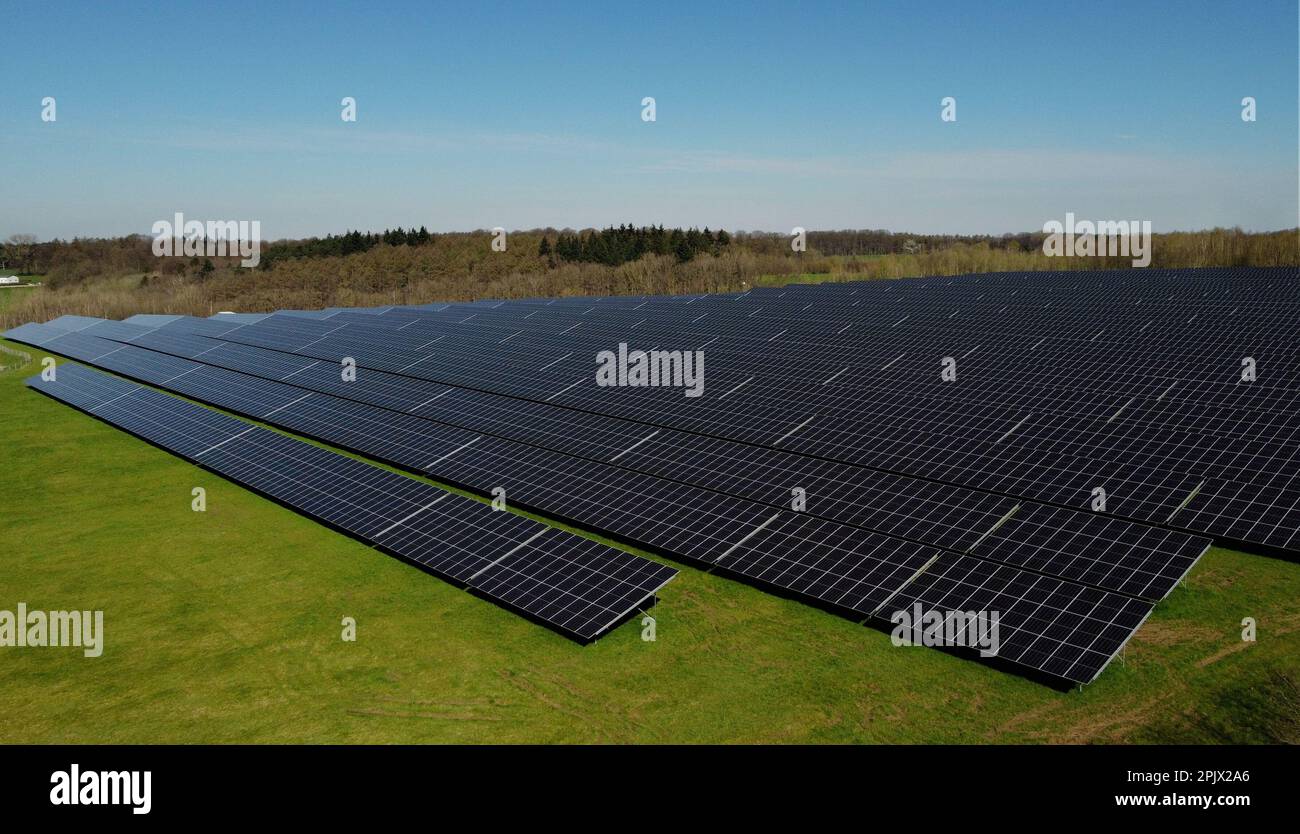 Aerial view of the largest Walloon solar panel installation, in Braine l'Alleud, Tuesday 04 April 2023. The municipality of Braine-l'Alleud inaugurated a field of photovoltaic panels of 19 hectares, designed by the municipal authorities and located in an old sand pit. Nearly 18,500 south-facing two-sided photovoltaic panels will provide up to 40 million kWh each year - i.e. the annual consumption of 4,000 households - and the electricity will arrive directly on the site of the UCB company, located at a few hundred meters. BELGA PHOTO ERIC LALMAND Credit: Belga News Agency/Alamy Live News Stock Photo