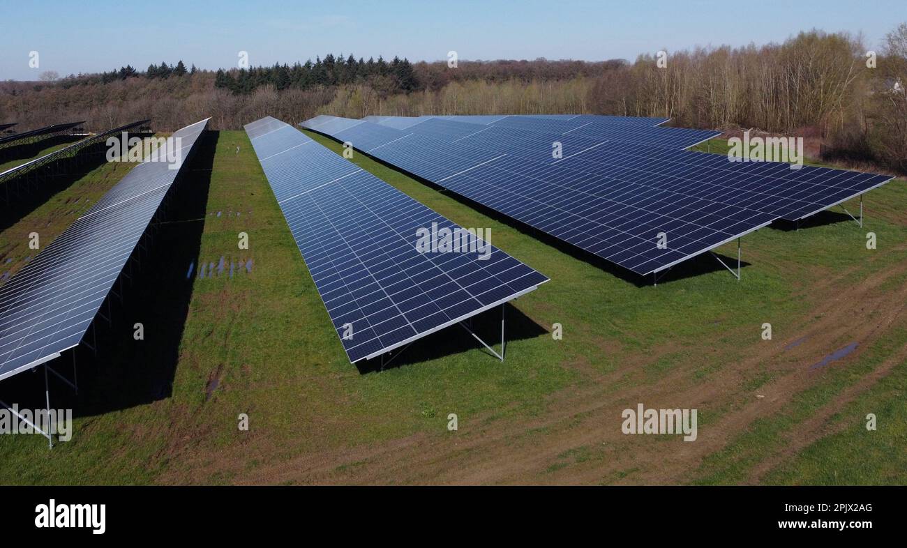 Aerial view of the largest Walloon solar panel installation, in Braine l'Alleud, Tuesday 04 April 2023. The municipality of Braine-l'Alleud inaugurated a field of photovoltaic panels of 19 hectares, designed by the municipal authorities and located in an old sand pit. Nearly 18,500 south-facing two-sided photovoltaic panels will provide up to 40 million kWh each year - i.e. the annual consumption of 4,000 households - and the electricity will arrive directly on the site of the UCB company, located at a few hundred meters. BELGA PHOTO ERIC LALMAND Credit: Belga News Agency/Alamy Live News Stock Photo