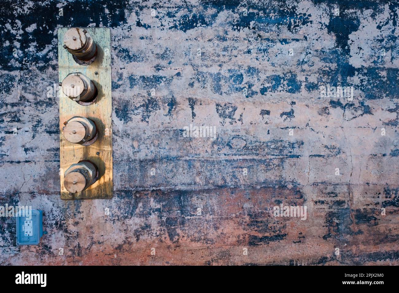 Brass standpipe ends set in rustic wall Stock Photo - Alamy