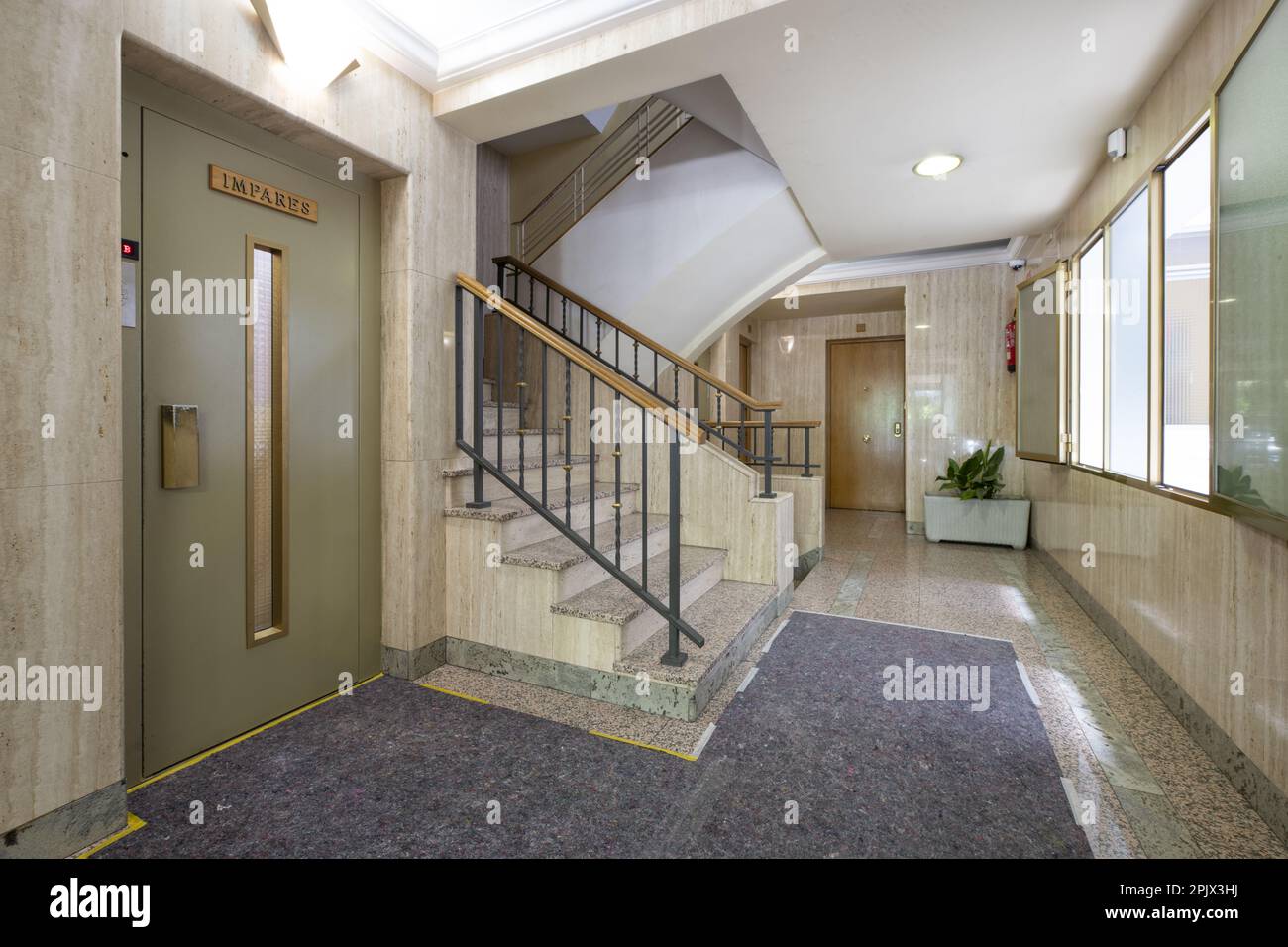 Interior portal of a residential housing building with carpet on the
