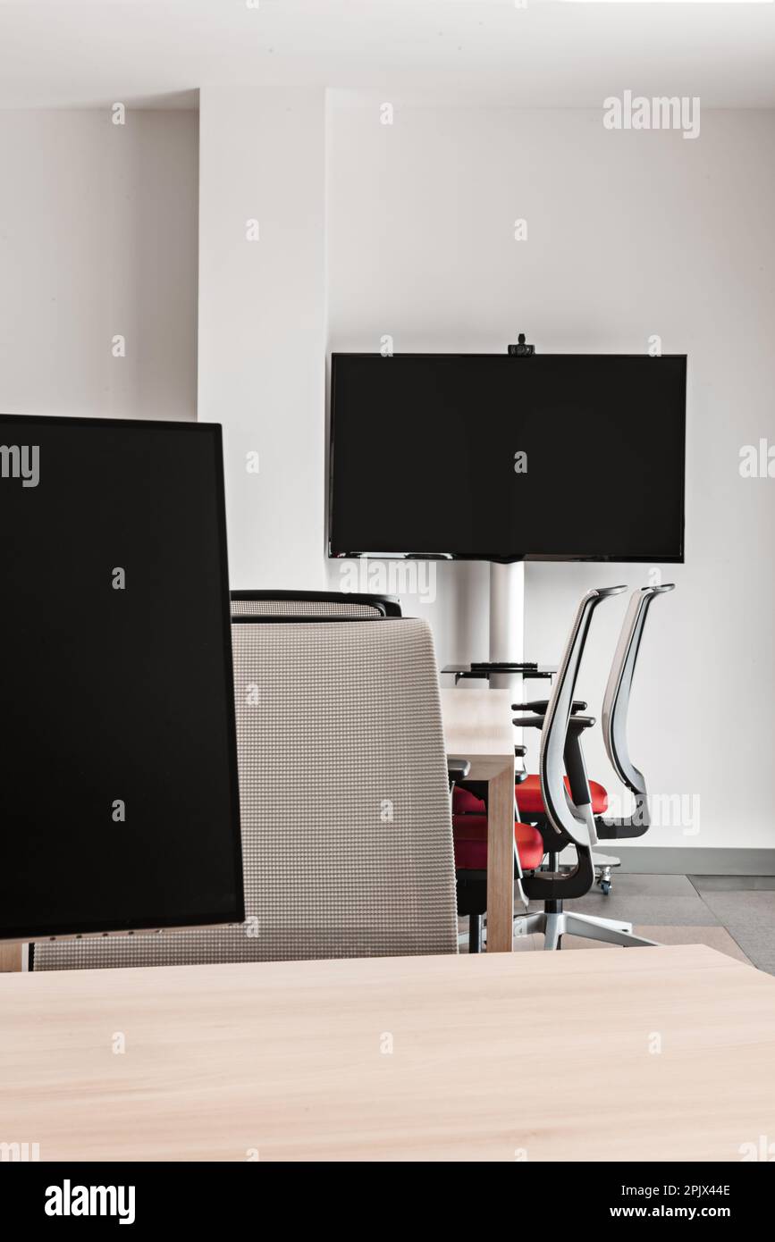 Professional office with large televisions and computer screens