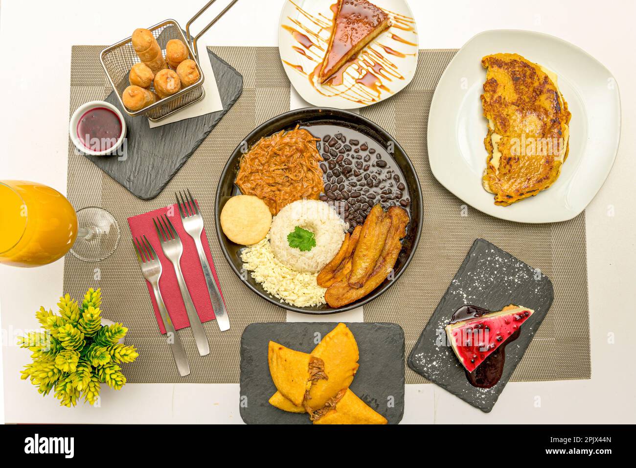 Some typical dishes of Venezuelan food with a flag tray, cachapas