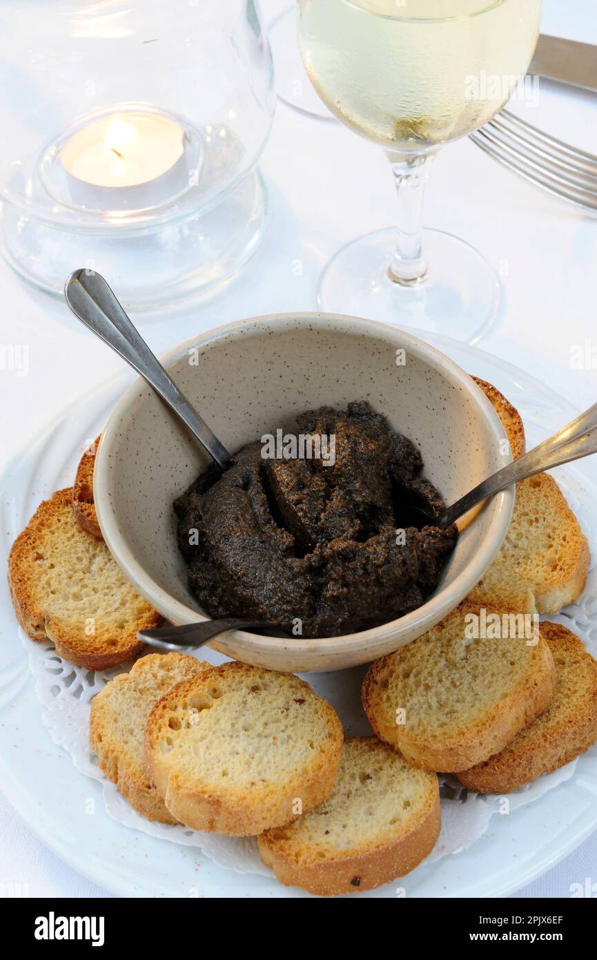 Tapenade and crostini, a typical appetizer of Provence, France Stock
