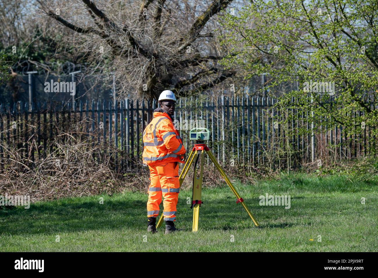 Ruislip, UK. 4th April, 2023. Following recent bubbling pools of liquid that have formed on the playing fields of Ruislip Rugby Club underneath where HS2 are tunnelling for the High Speed Rail link, tunnel boring machine Sushila, has been paused pending further investigation. HS2 were doing surveys at the site today and along nearby residential streets underneath where HS2 are due to tunnel. Some local residents are very alarmed that HS2 have come and done surveys at their homes and taken photos of any existing cracks in the walls. HS2 have also put up black plastic along fencing around an are Stock Photo